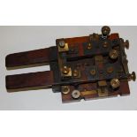 An early 20th century mahogany and brass mounted commutator telegraph sending key