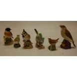 A collection of six Royal Worcester bird figures to include; Goldcrest, Wren, Thrush, Stonechat,