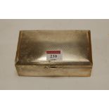 A George V silver table cigarette box, of canted rectangular form,