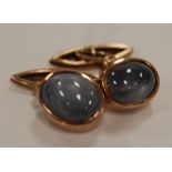 A pair of 9ct gold and cabochon 'star' sapphire set gents cufflinks, 1.