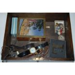 An oak box and contents to include sundry watches,