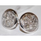 A pair of white metal and rose-cut diamond set ear studs, dia.