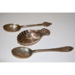 A silver and embossed caddy spoon having shell bowl together with a silver souvenir spoon and one