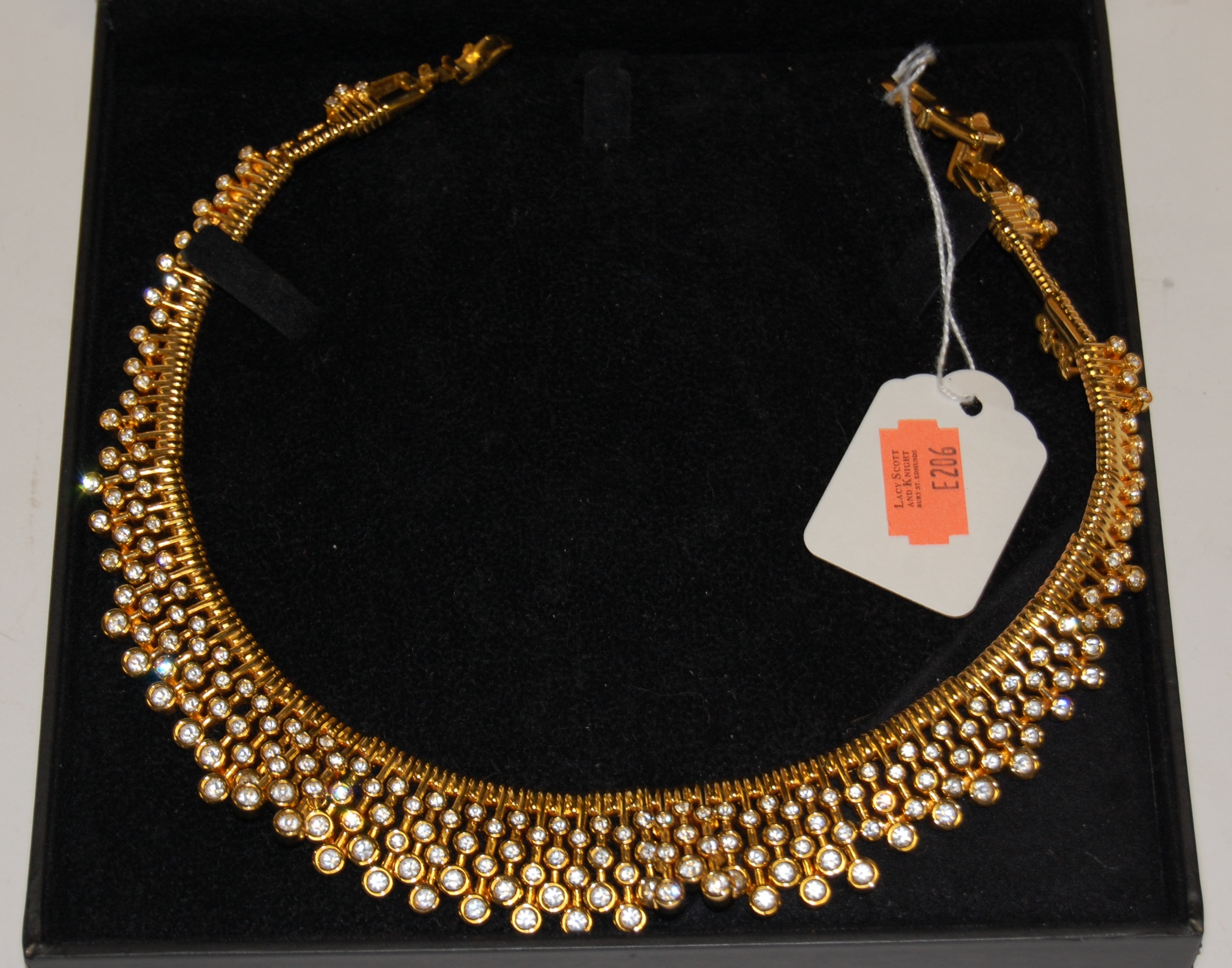 A Swarovski gilt metal and crystal set necklet in original box