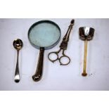 A pair of 19th century white metal sugar bows together with silver handled magnifying glass,