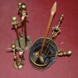 A collection of miscellaneous brasswares to include fire tools, helmet shaped coal scuttle,