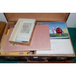 A leather suitcase and contents to include; loose stamps,