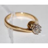 An 18ct gold diamond solitaire ring, the illusion set brilliant weighing approx 0.