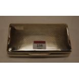 A George V silver table cigarette box of rectangular form having engine turned decoration,