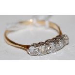 An 18ct gold diamond five stone ring, the graduated claw set old brilliants in a line setting,