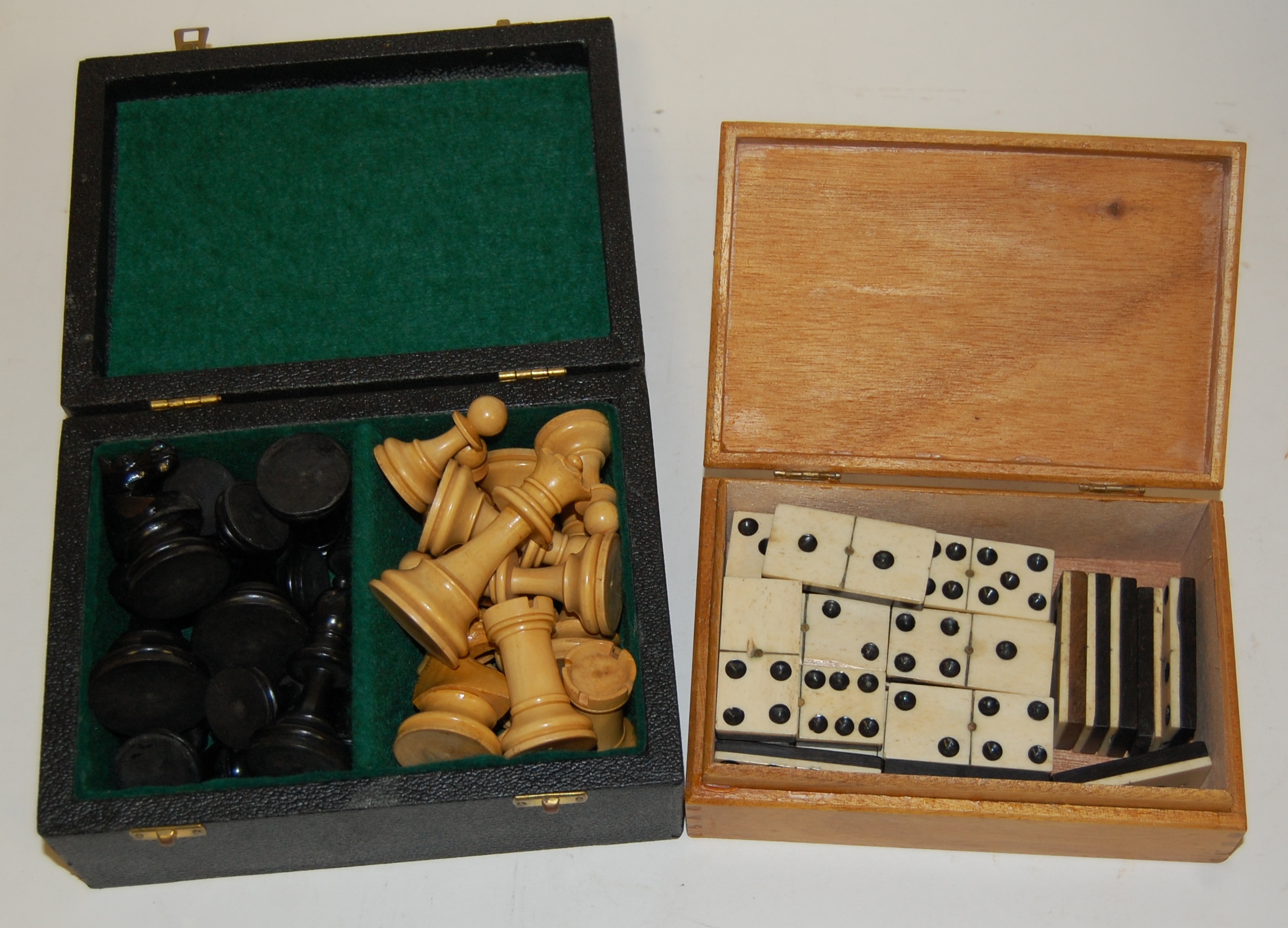 A set of turned ebony and boxwood chess pieces;