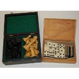 A set of turned ebony and boxwood chess pieces;