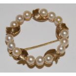 A modern 9ct gold small cultured pearl set brooch,