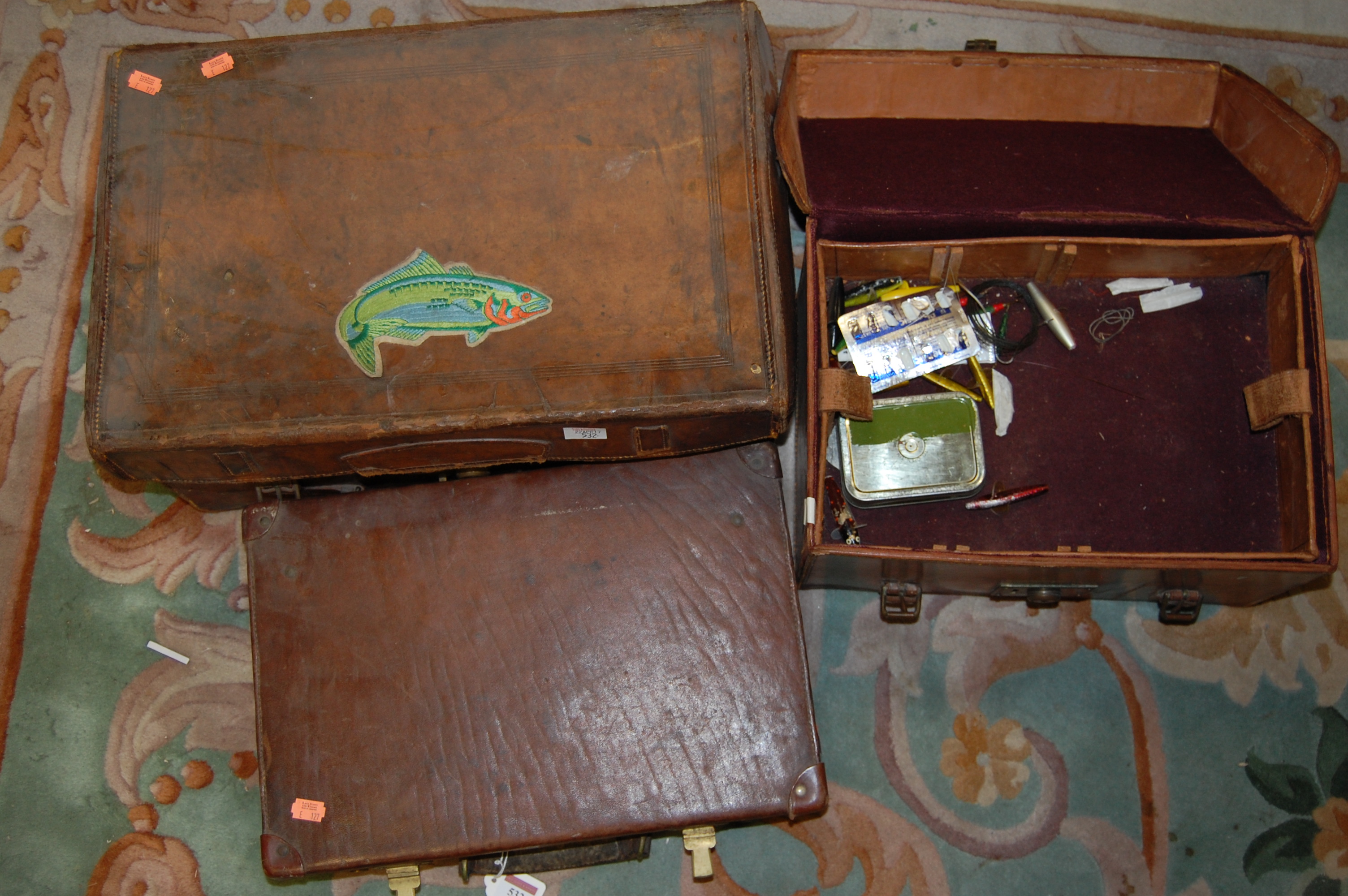 Three various early 20th century brown leather cases