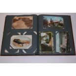 A postcard album and contents to include mainly early 20th century British topographical examples