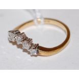 An 18ct gold five diamond set wishbone ring,