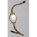 A Seiko steel and gilt metal cased ladies quartz wrist watch on 9ct gold associated bracelet,