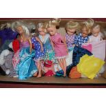 A box of various Sindy and other children's dolls and accessories