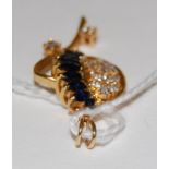 A modern yellow metal sapphire and pave diamond set pendant 3.5g, 3.