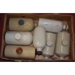 A box of assorted stoneware foot-warmers to include Doulton examples