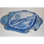 A circa 1900 Dutch Delft blue & white wall plaque decorated with various sailing ships and figures