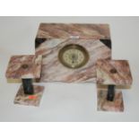 An Art Deco rouge marble cased clock garniture,