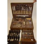 An early 20th century oak cased canteen of six place setting silver plated cutlery;