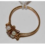 A ladies 9ct gold ruby and seed pearl set ring size N-