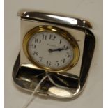 A travelling pocket watch having keyless 8-day movement and housed in a silver easel case