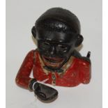 A reproduction cast iron novelty money-box