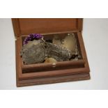 A carved softwood trinket box and contents to include silver button, yellow metal cufflinks,