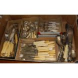 A box of assorted Victorian and later silver plated flatwares to include; fish servers,