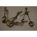 Assorted silver flatwares to include table fork, caddy spoon, dessert spoons,