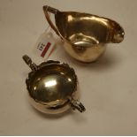 A George III silver helmet shaped cream jug;