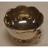 A small George V silver twin handled bowl, having castellated decoration, by William Hutton & Sons,