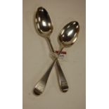 A pair of George III silver table spoons in the Old English pattern having monogrammed terminals,