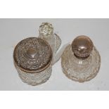 An early 20th century hobnail cut glass and silver topped scent bottle;