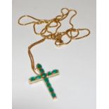 An 18ct gold and emerald set cross pendant, 2.