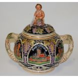 A German pottery twin handled tureen and cover, relief decorated with landmarks, h.