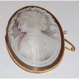 A Victorian carved shell cameo brooch, depicting profile portrait of a maiden,