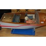 A petrol driven radio controlled kitbuilt model of an open topped cabin cruiser