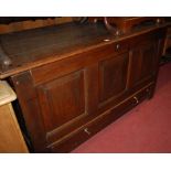 An 18th century joined oak hinge top mule chest having twin lower drawers,