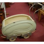 A mid-20th century baby's pram,