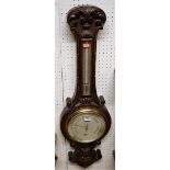 Circa 1900 Negretti & Zamba carved oak two dial wheel barometer