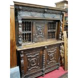 A Continental low relief carved oak and geometric moulded buffet side cupboard,