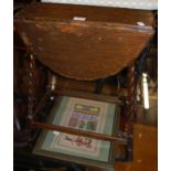 A small early 20th century barleytwist oak dropflap occasional table;