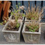A set of four reconstituted stoneware planters of classical square tapering form