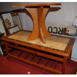 A teak and tile top coffee table,