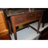 A 19th century oak three drawer lowboy