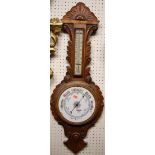 Circa 1900 carved oak aneroid wheel barometer